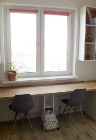 Шкаф со столом в детскую возле окна