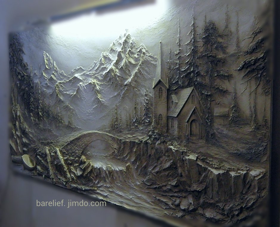 Барельеф карта мира на стене