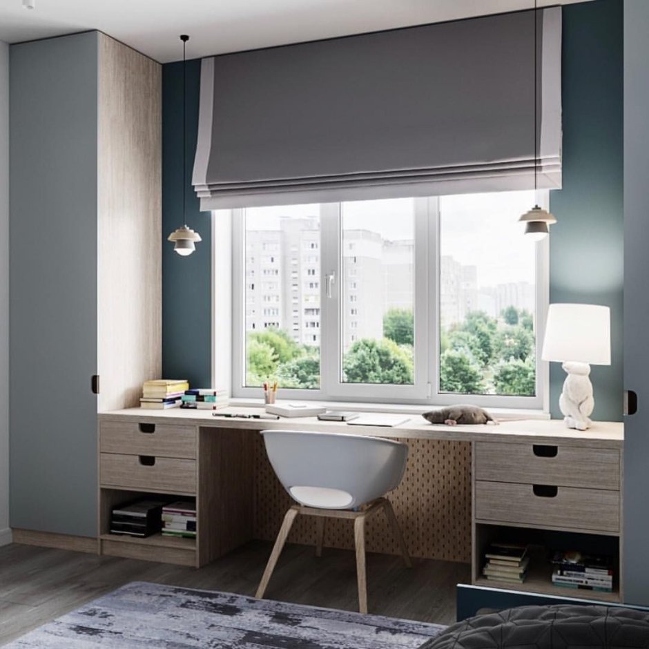 Письменный стол у окна в детской