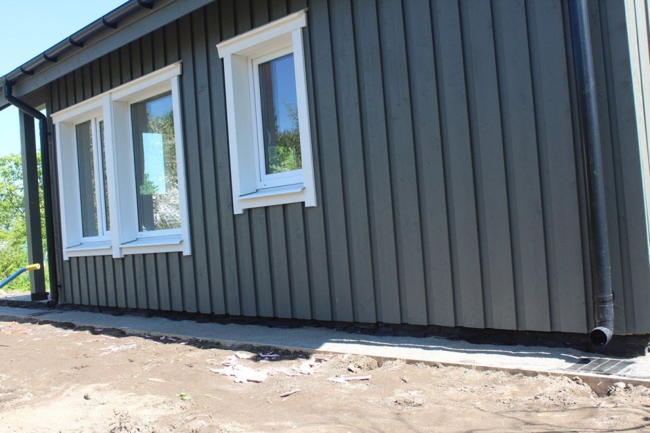 Отделка фасада вертикальной доской