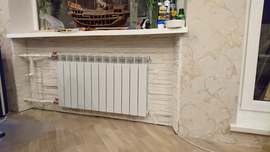 Внутрипольный конвектор в подоконнике