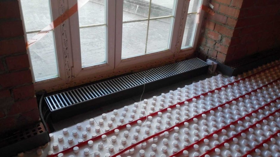 Внутрипольный конвектор в подоконнике