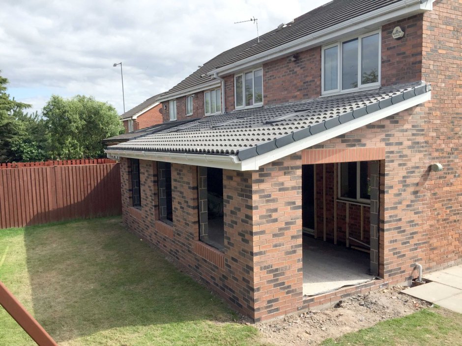 Пристройка к кирпичному дому