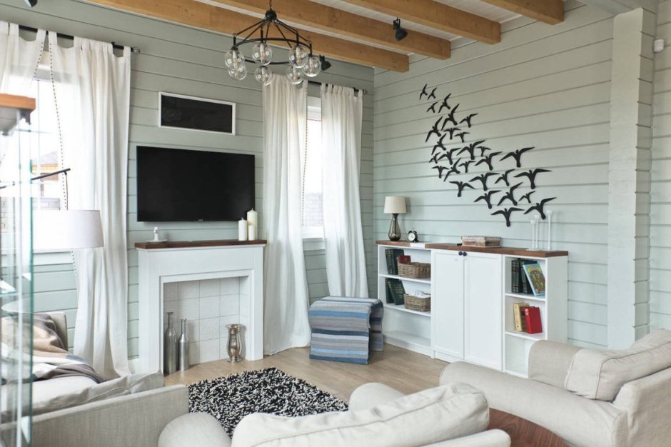 Гостиная в скандинавском стиле в деревянном доме