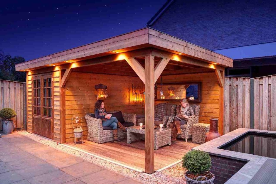 Баня с односкатной крышей и террасой и зоной барбекю